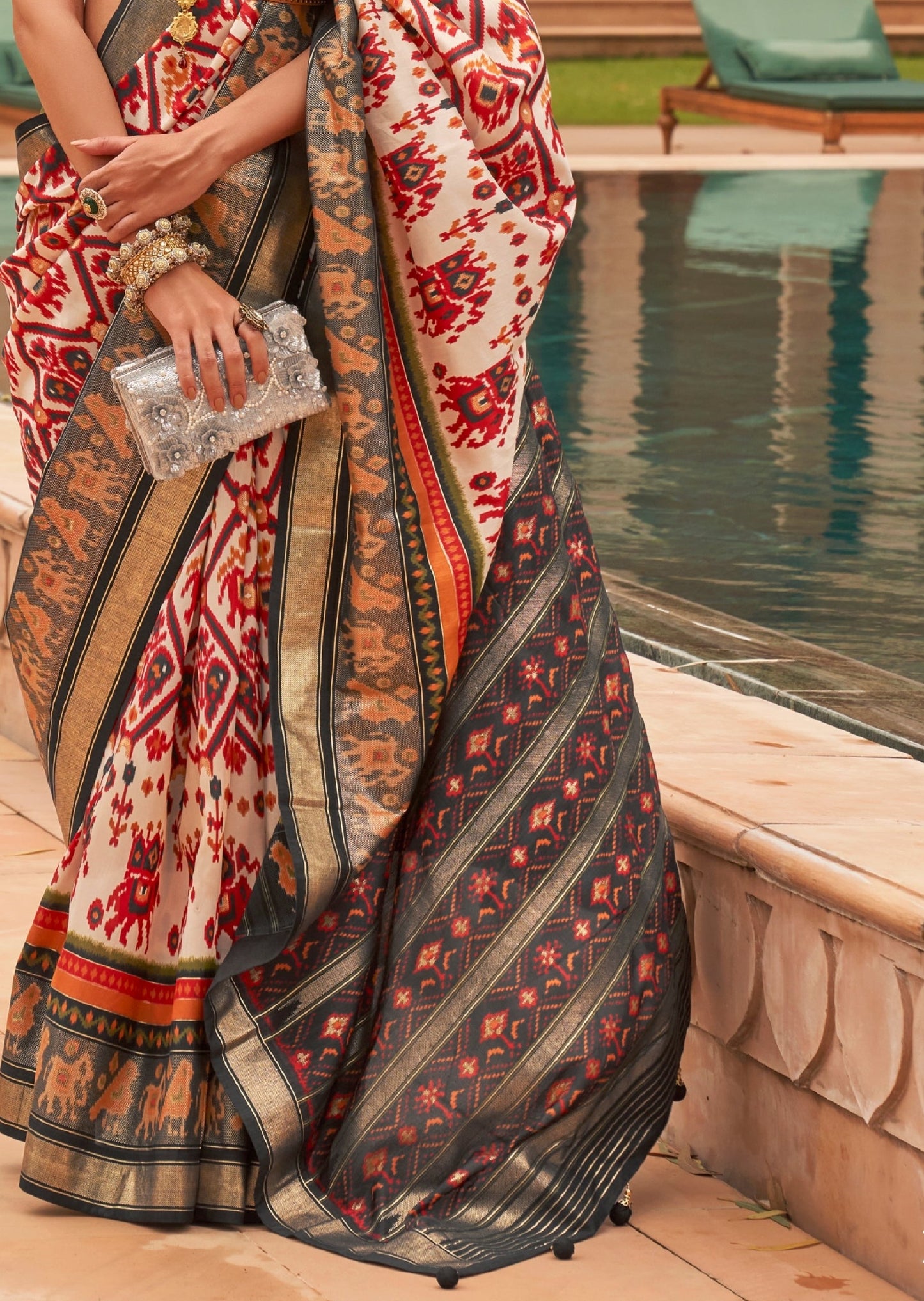 Double ikkat white patola saree pallu designs online.