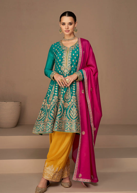 Bride in pant style Salwar suit in blue colour with contrast red dupatta
