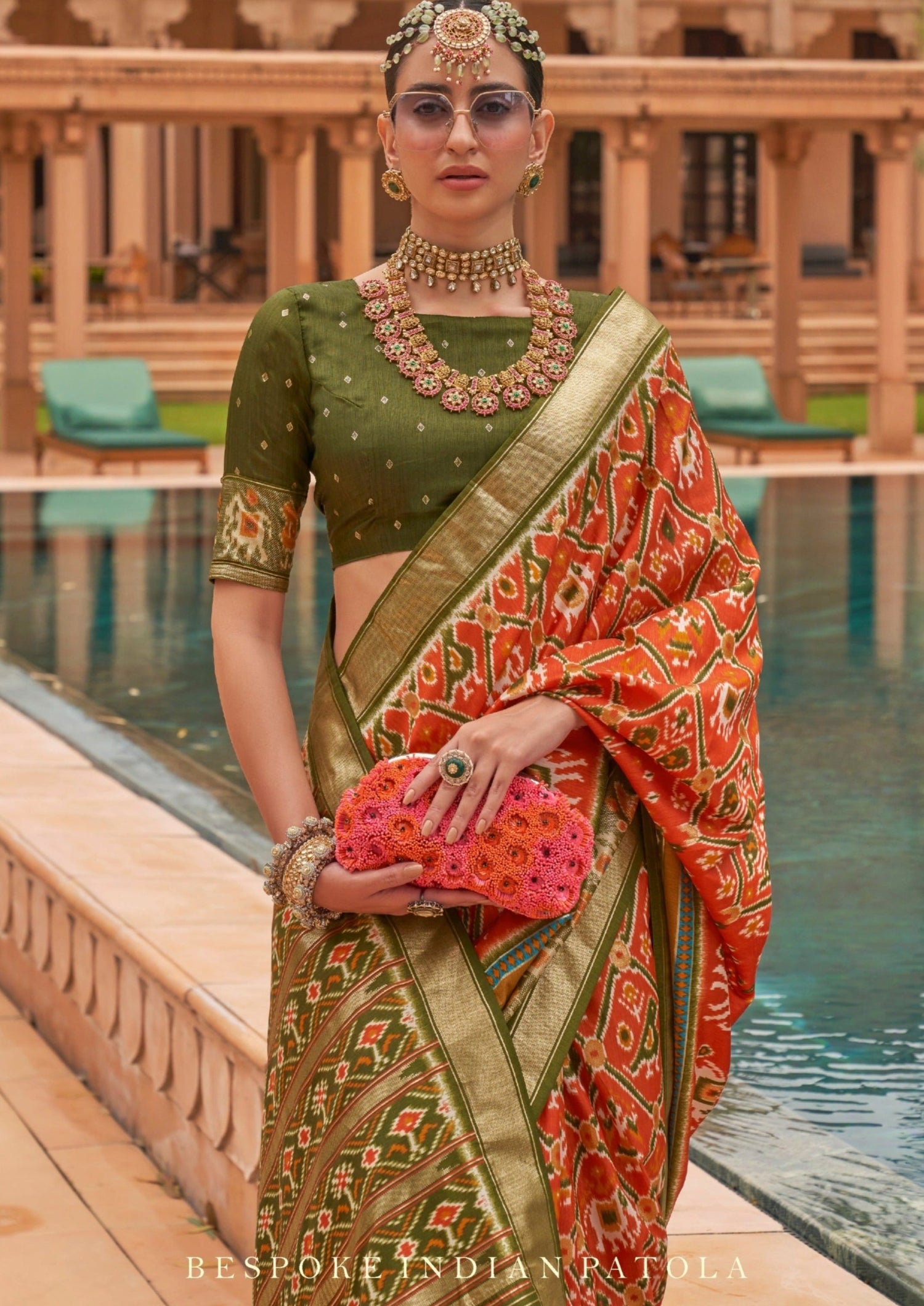 Orange patola double Ikkat silk saree online for wedding.