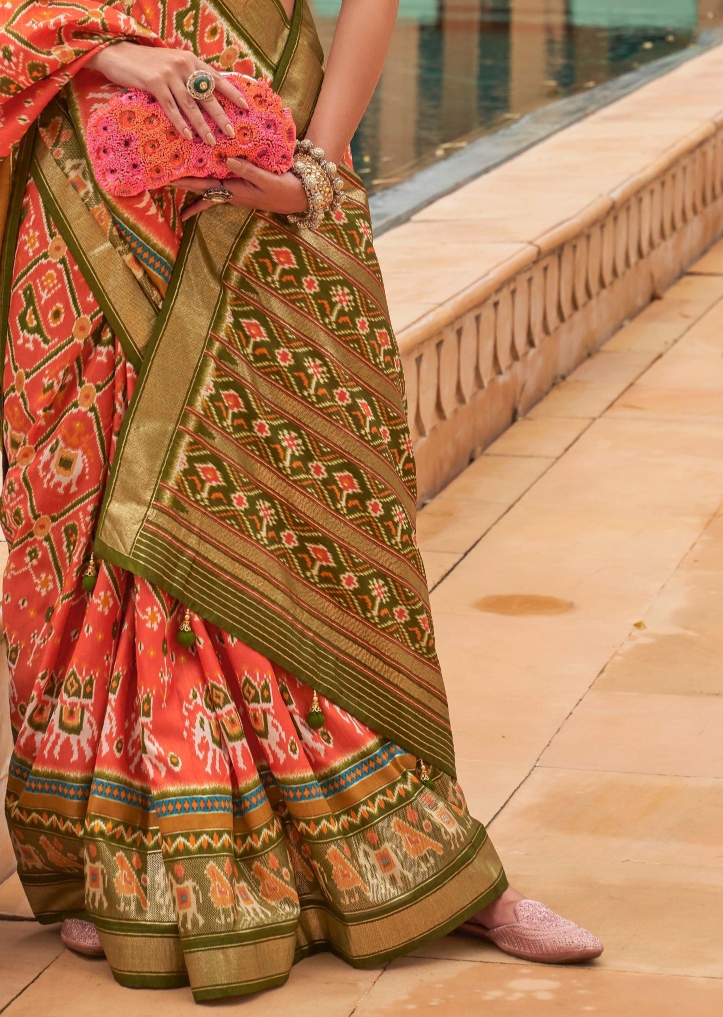 Orange patola Ikkat saree pallu designs online price.