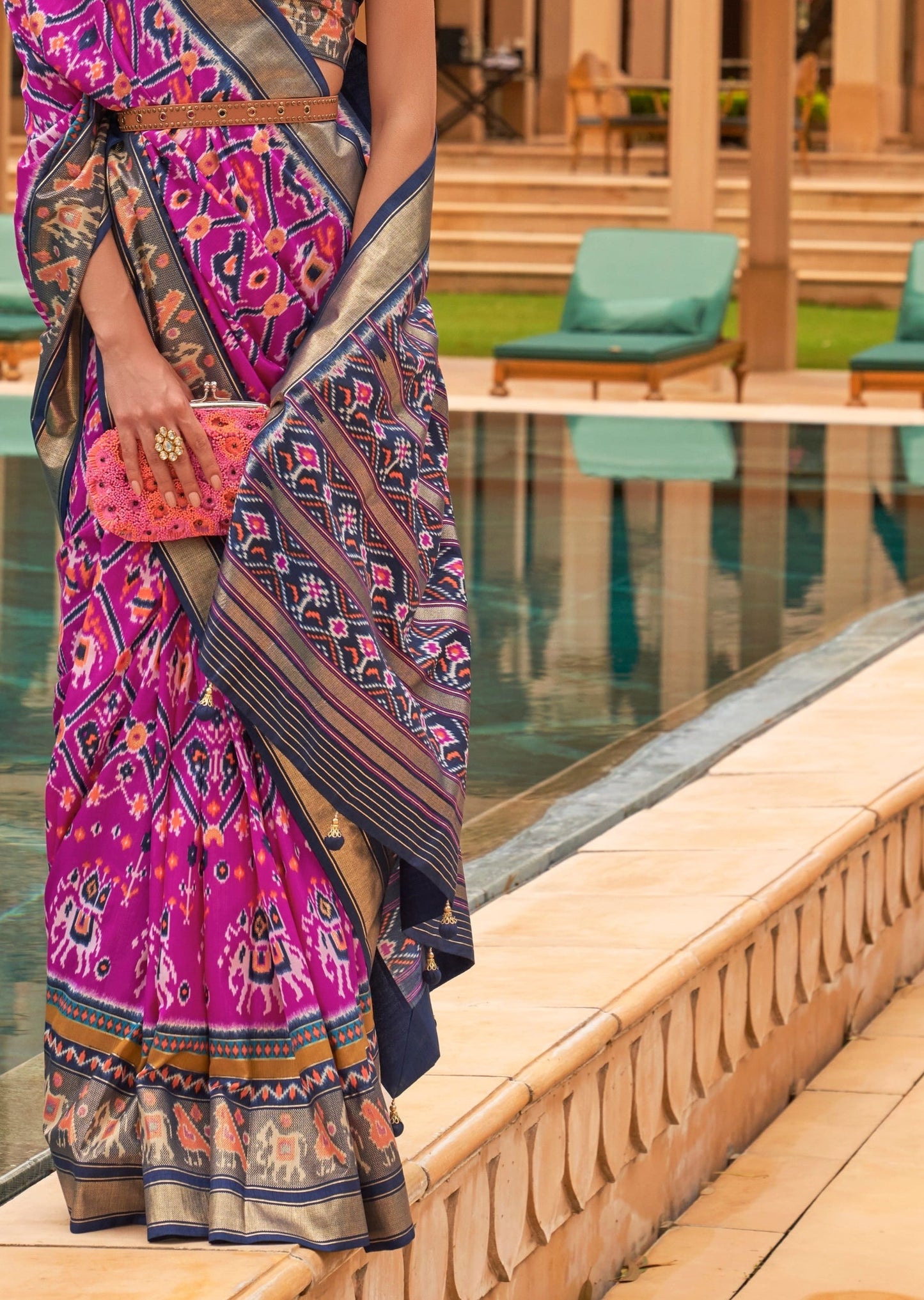Pink Patola saree pallu designs online.