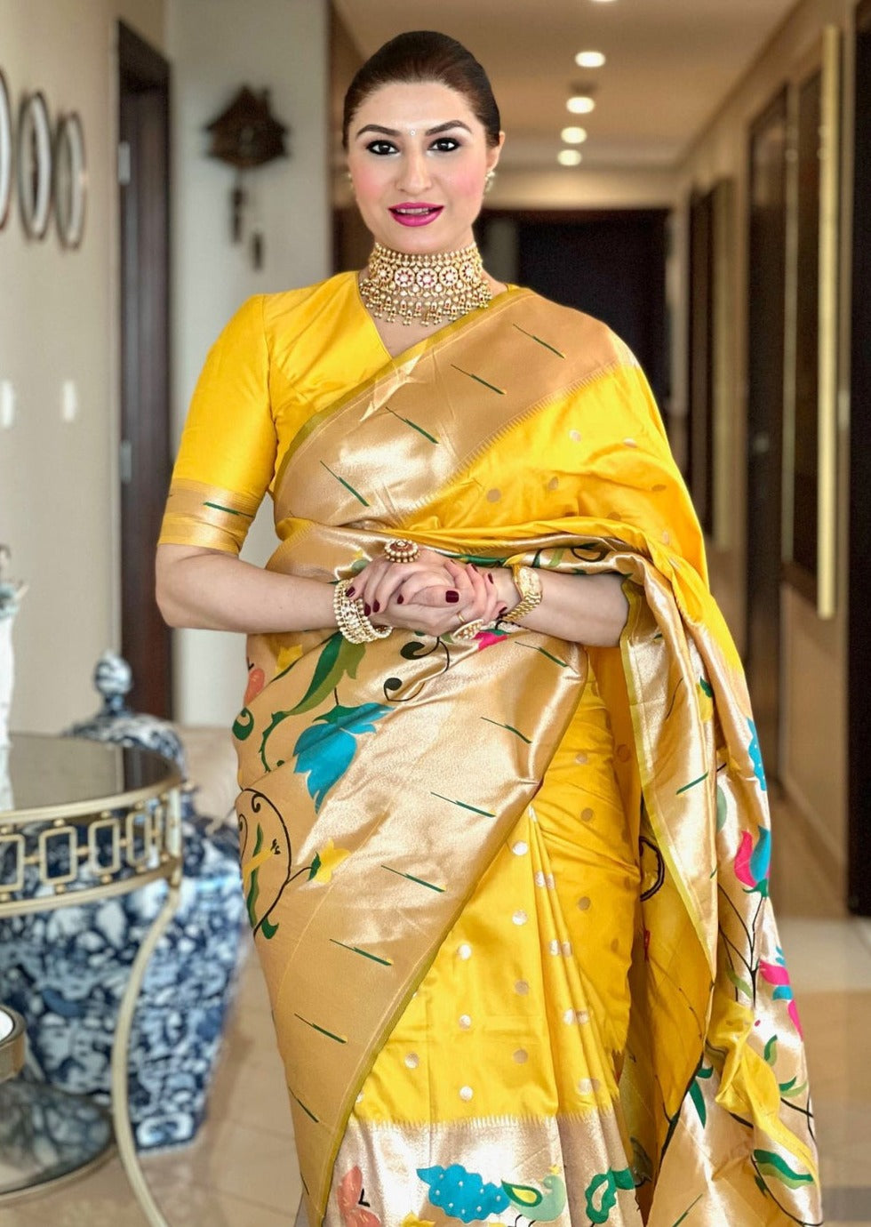 Style by pcg in Pure Handloom Paithani silk yellow saree with a matching blouse piece.