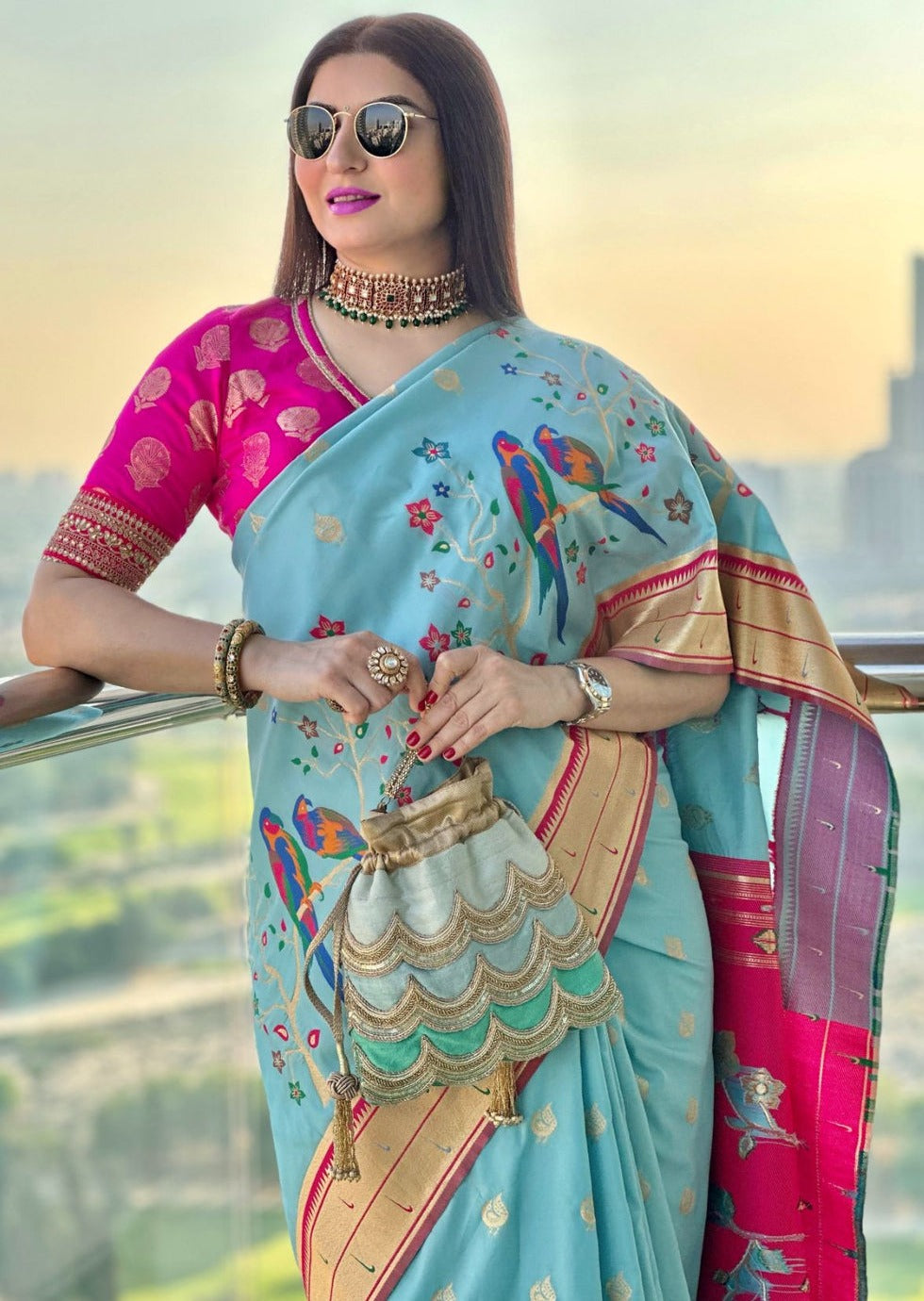 Sky blue paithani silk handloom saree online with contrast pink blouse.