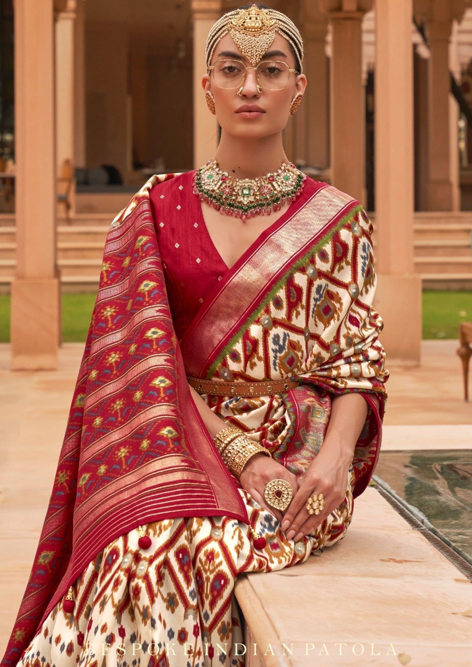Woman in double ikat white patola silk saree online shopping.