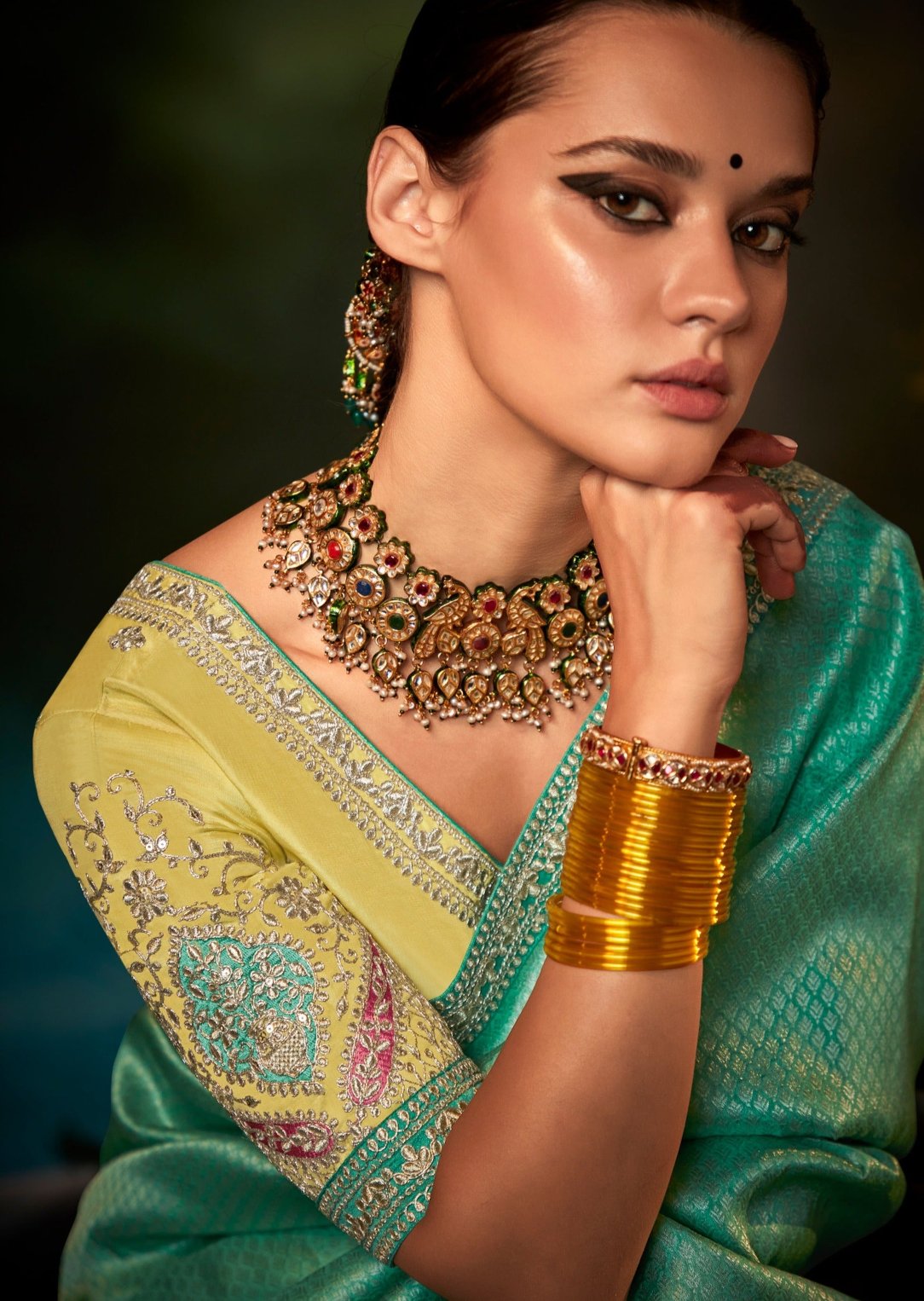 Yellow and blue banarasi silk bridal saree online with embroidered hand work.