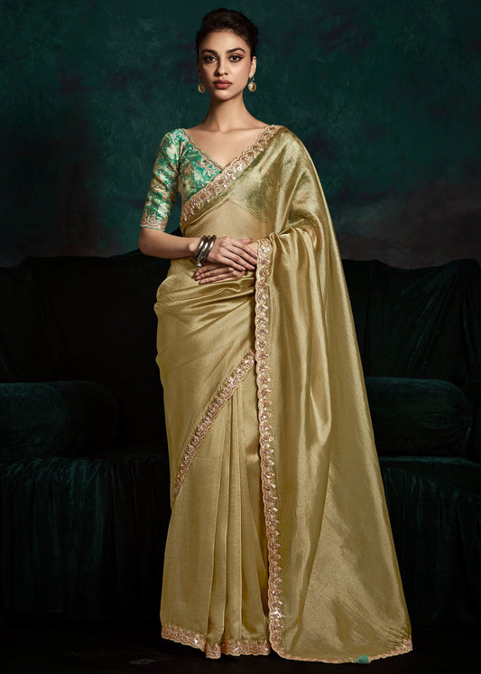 Golden Embroidered Sheer Silk Saree With Contrast Green Printed Blouse