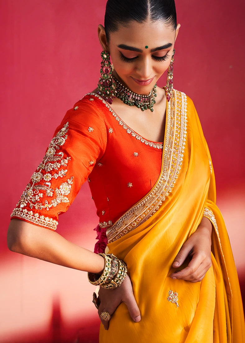 Yellow Silk Embroidered Saree With Orange Blouse