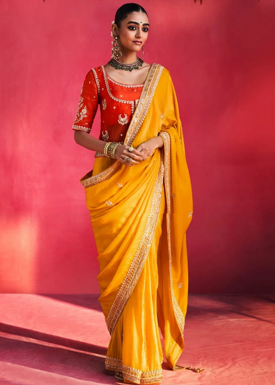 Yellow Silk Embroidered Saree With Orange Blouse