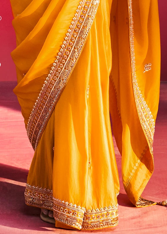 Yellow Silk Embroidered Saree With Orange Blouse
