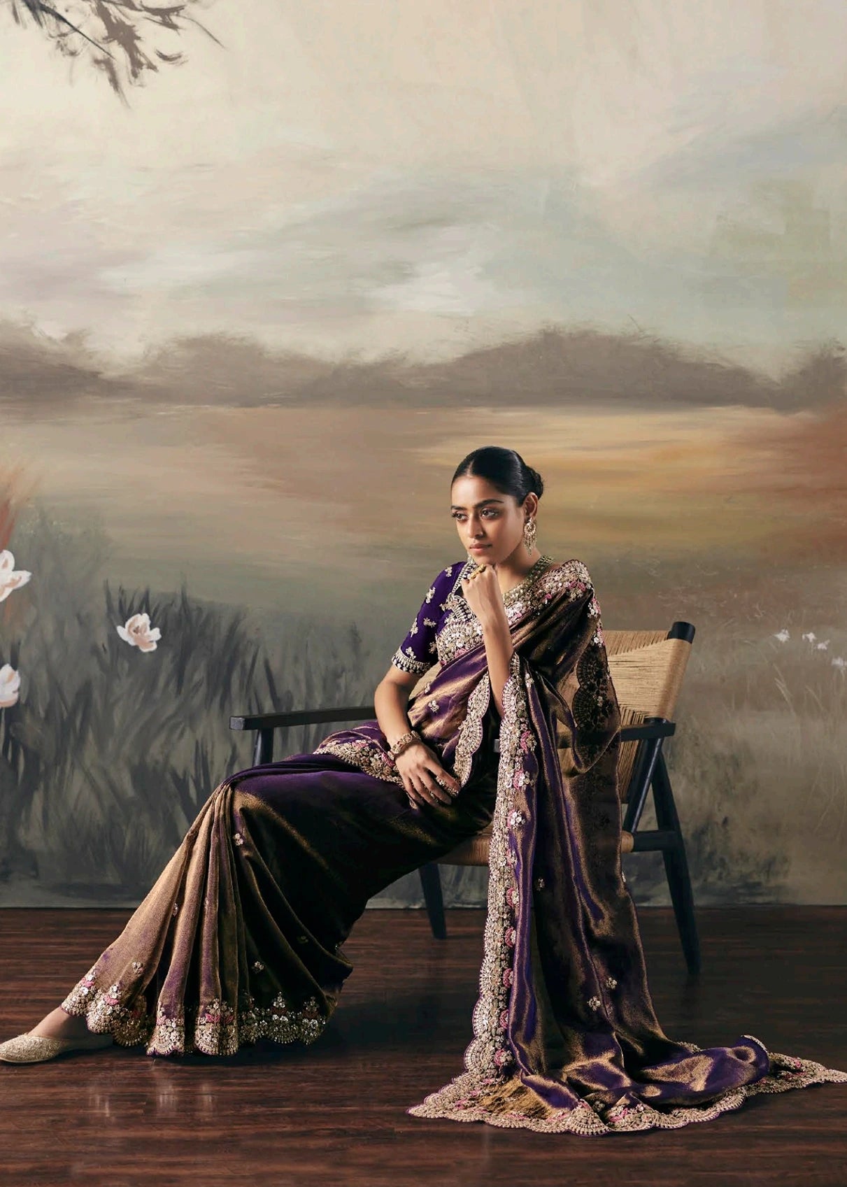 Bride wearing metallic copper brown tissue silk saree with purple blouse showcasing detailed view of pallu and border of metallic copper brown tissue. 
