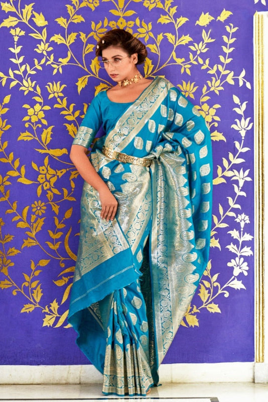 Bride in zari work turquoise blue banarasi silk bridal saree blouse for indian wedding.