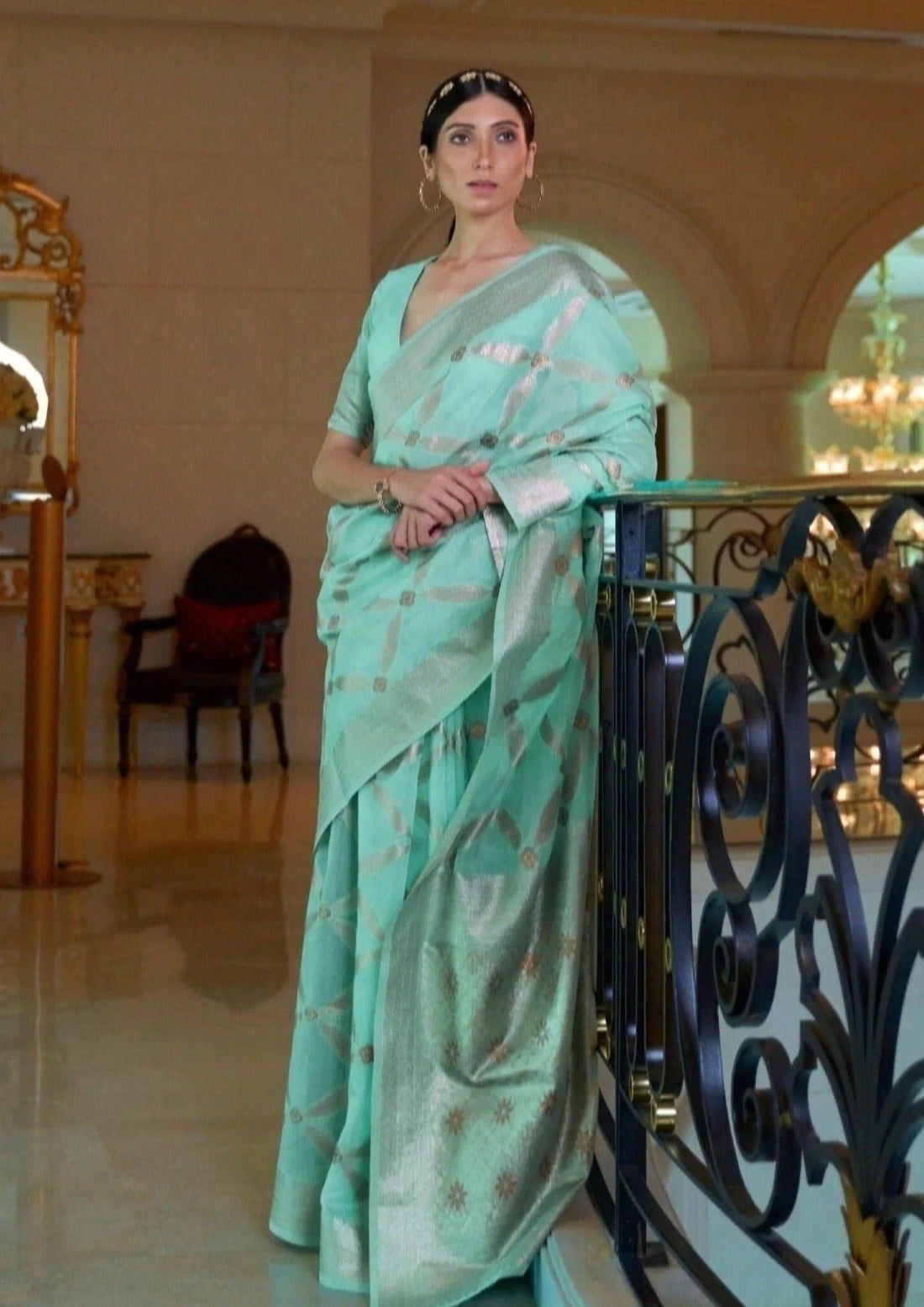 Woman in pure banarasi cotton aqua green handloom zari saree blouse.