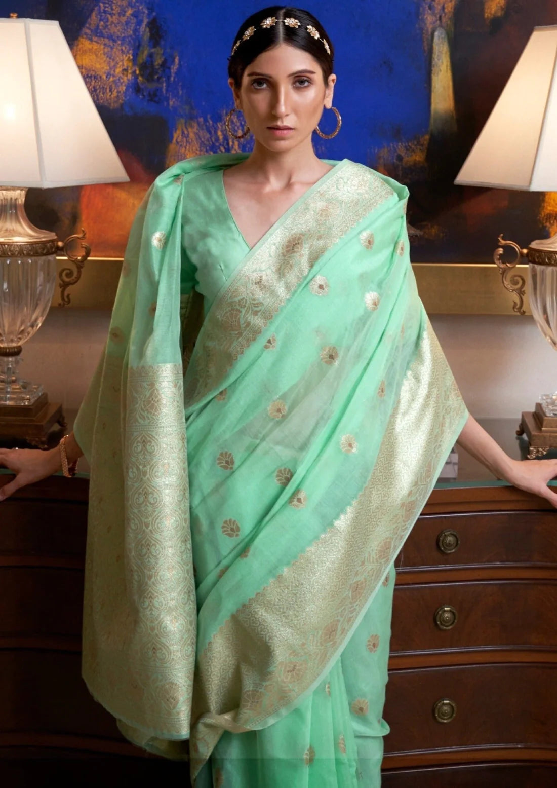 Woman in banarasi cotton handloom mint green saree blouse.