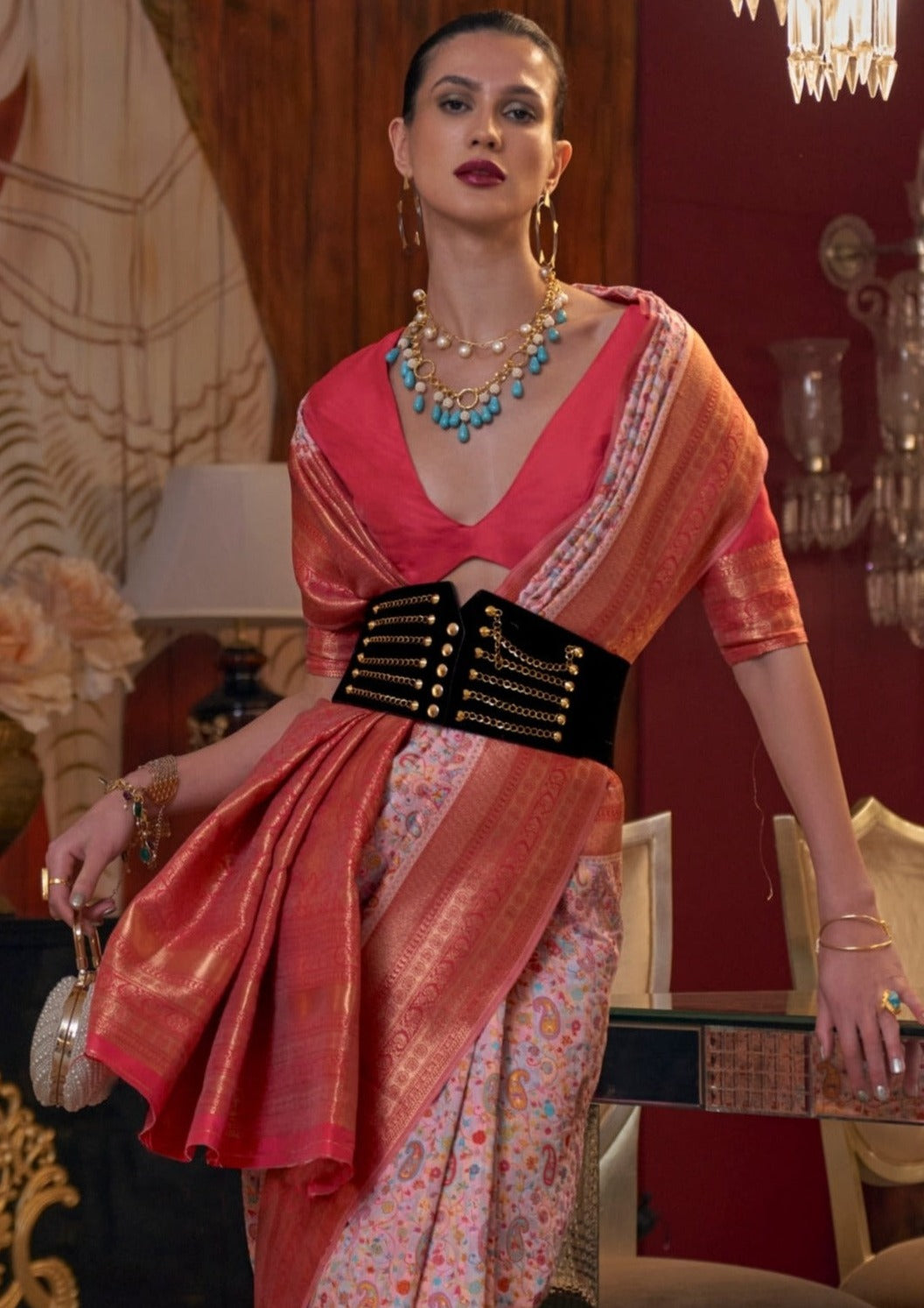 Woman in pink kashmiri pashmina silk banarasi fusion saree with red blouse.