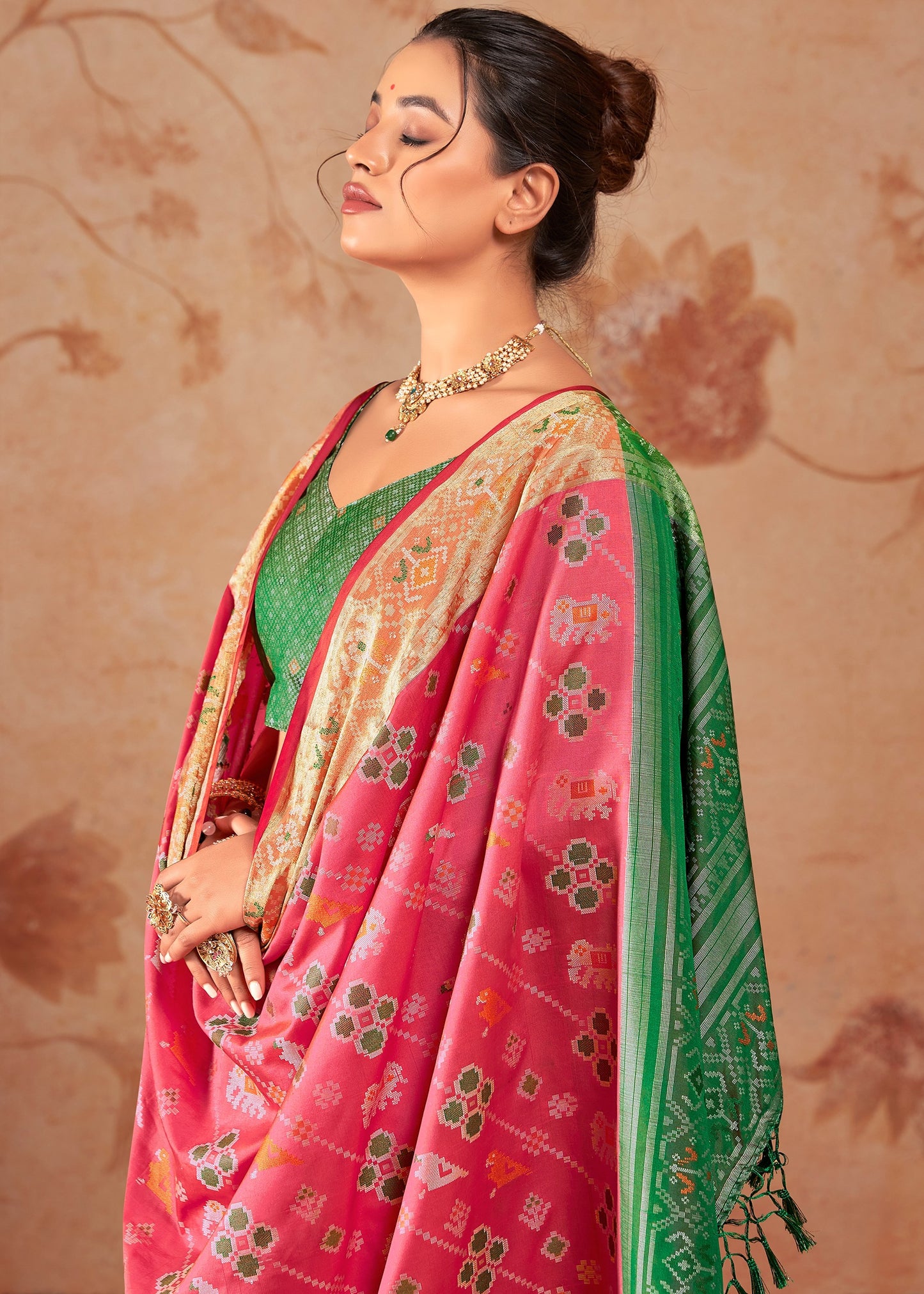 Red banarasi patola silk handloom saree online with contrast green blouse.