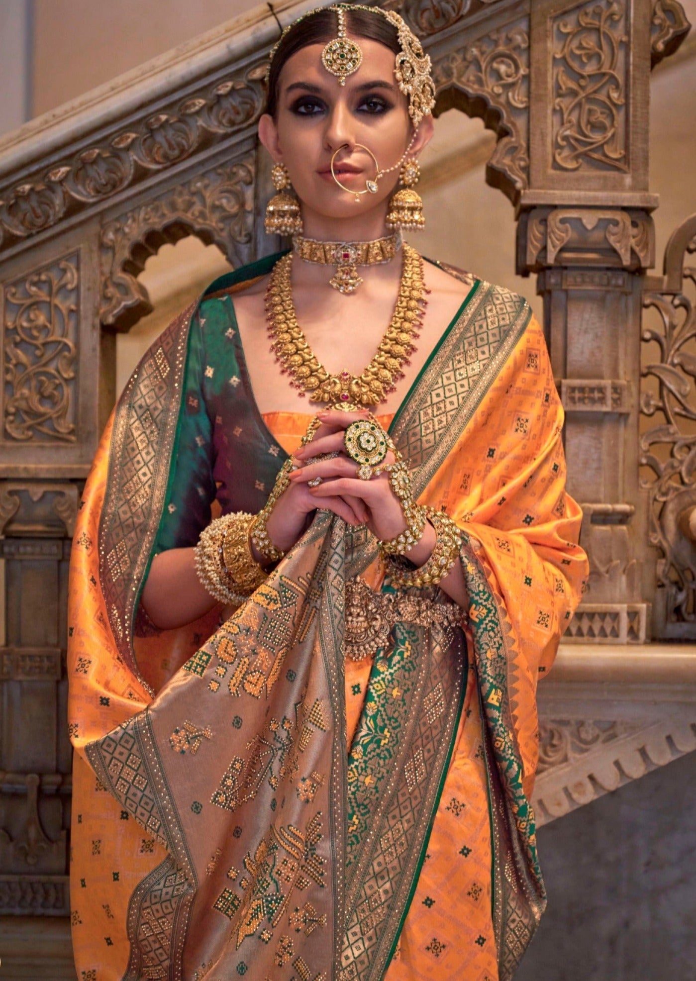 Banarasi patola handloom silk traditional orange bridal zari saree online.