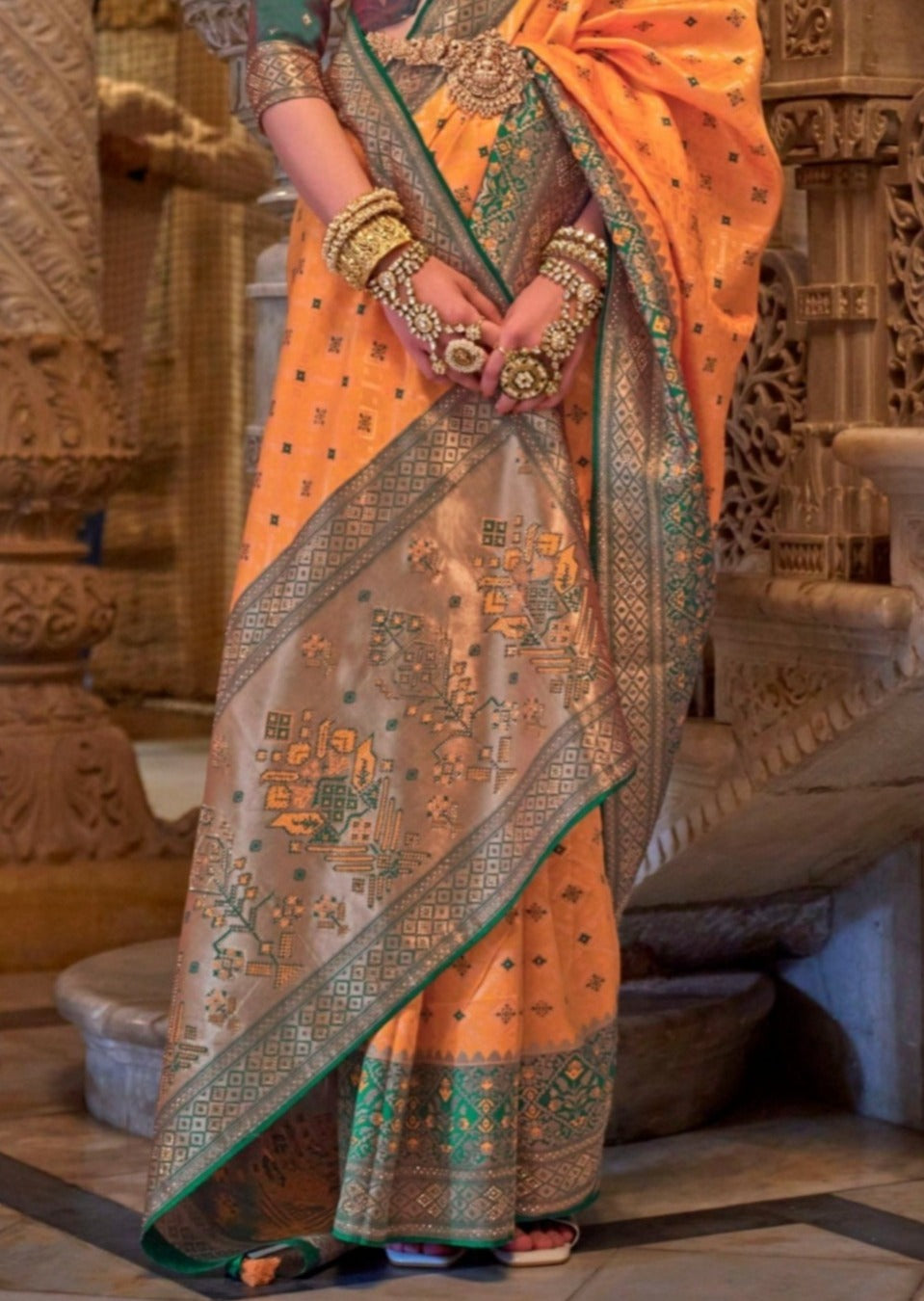 Banarasi patola handloom silk traditional orange saree online for wedding.