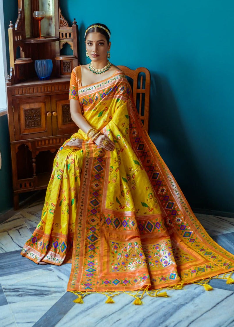 Fusion banarasi patola silk yellow saree with orange border and blouse, perfect for bride, haldi ceremony and festive wear available at best price for for online shopping.