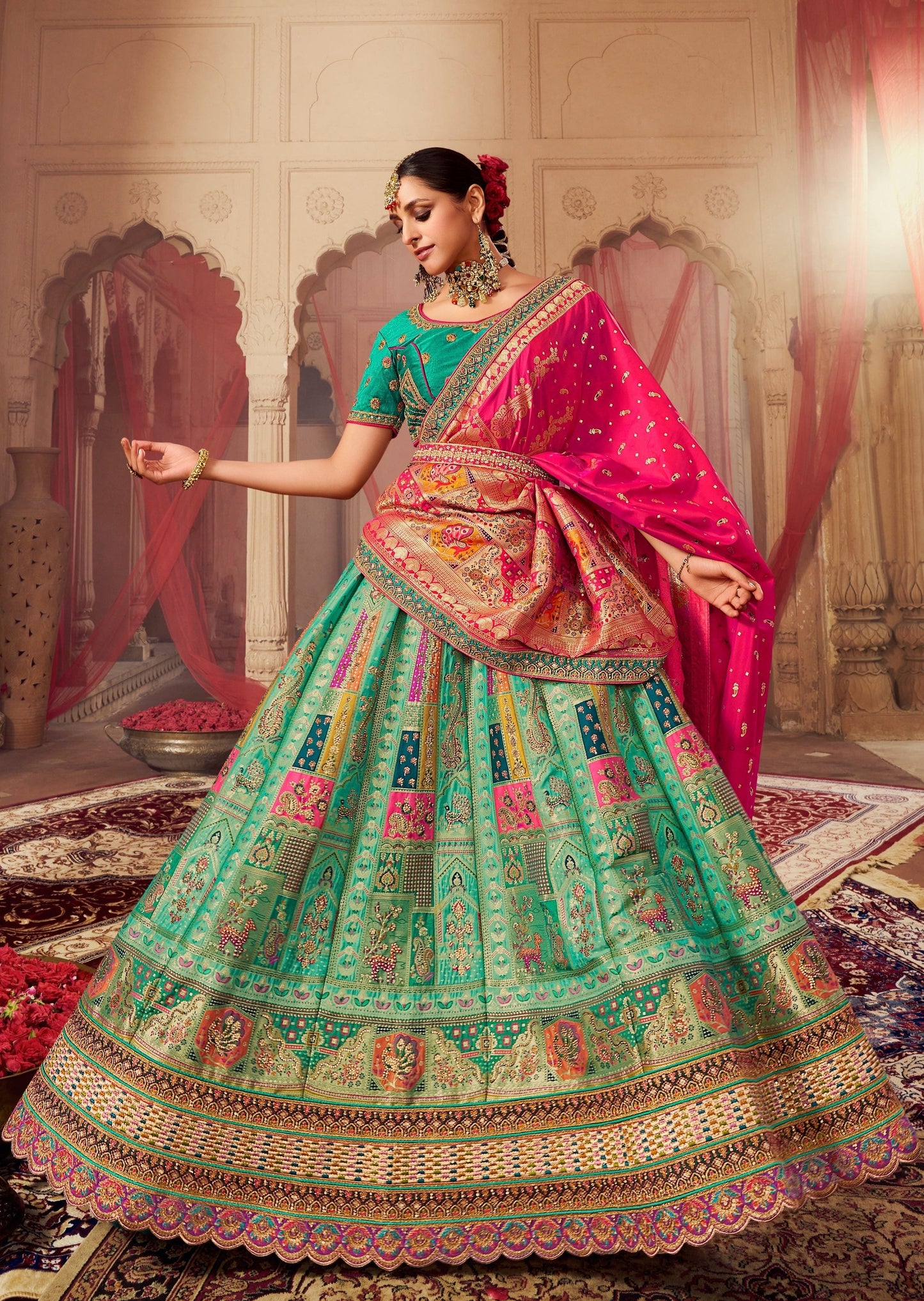 Bride in banarasi silk green lehenga choli with pink dupatta.