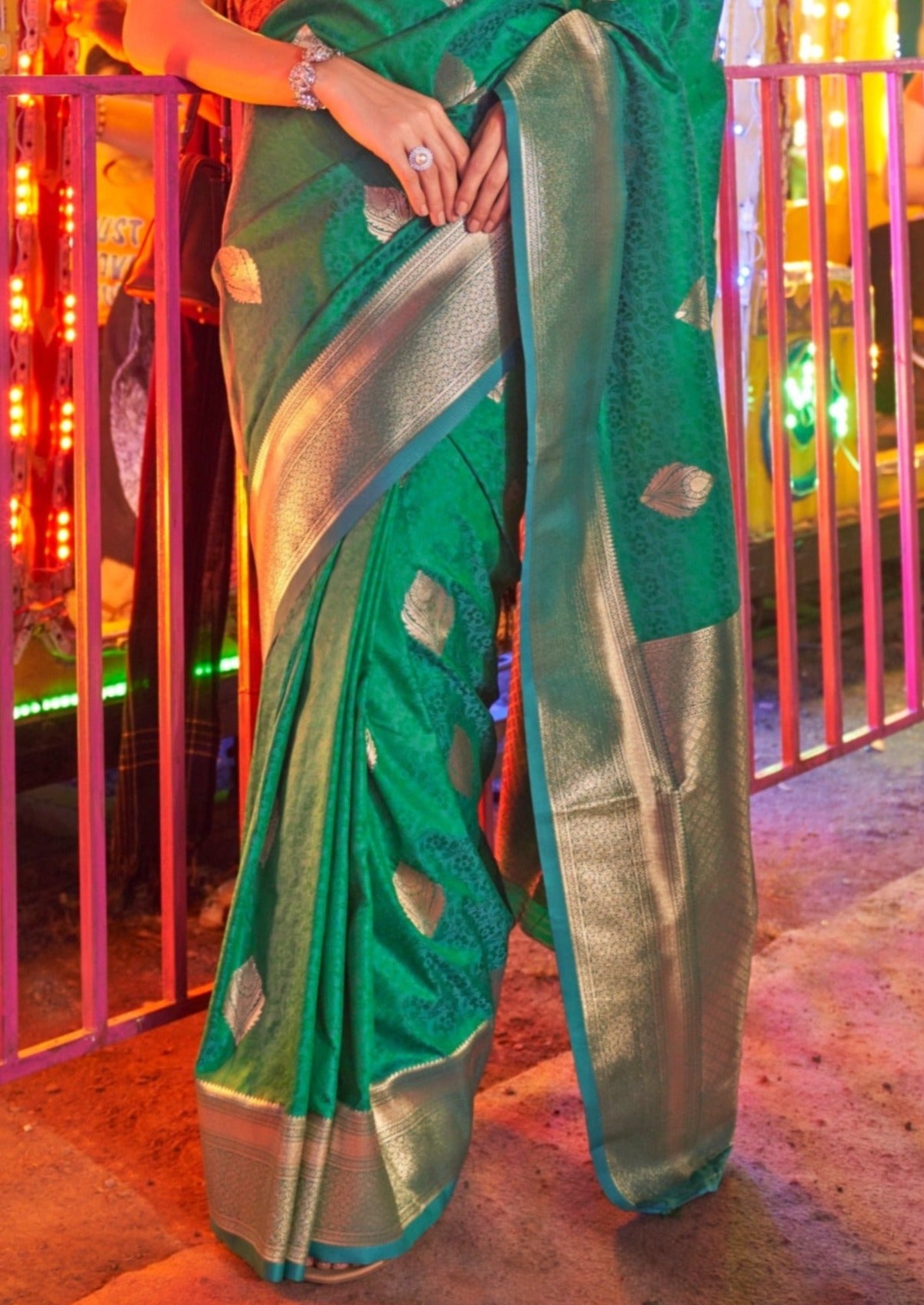 Banarasi silk emerald green handloom saree with golden zari border online.