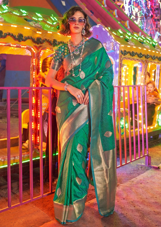 Banarasi silk emerald green handloom saree with golden zari border.