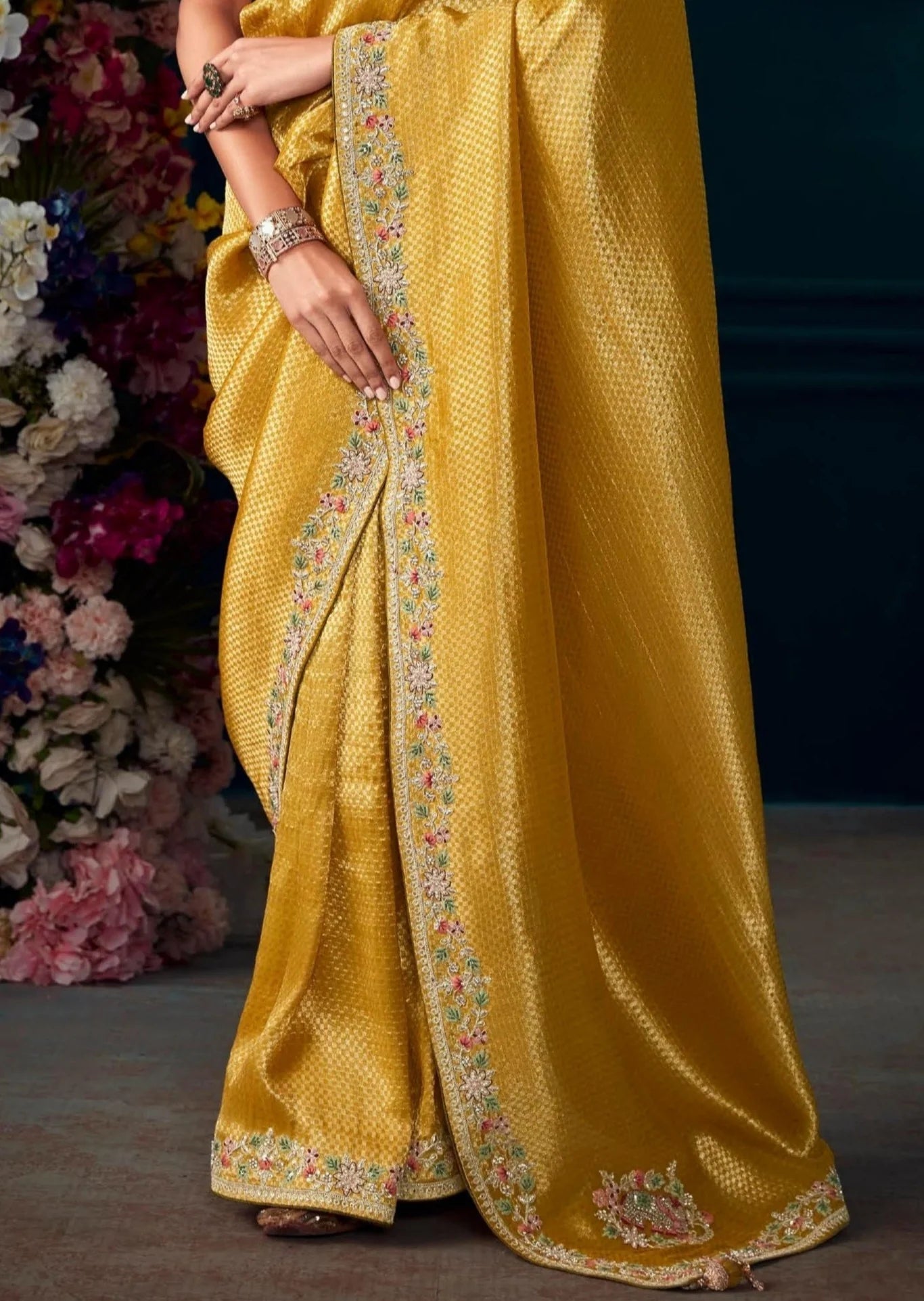 Banarasi silk handwork embroidered yellow saree online for haldi function.