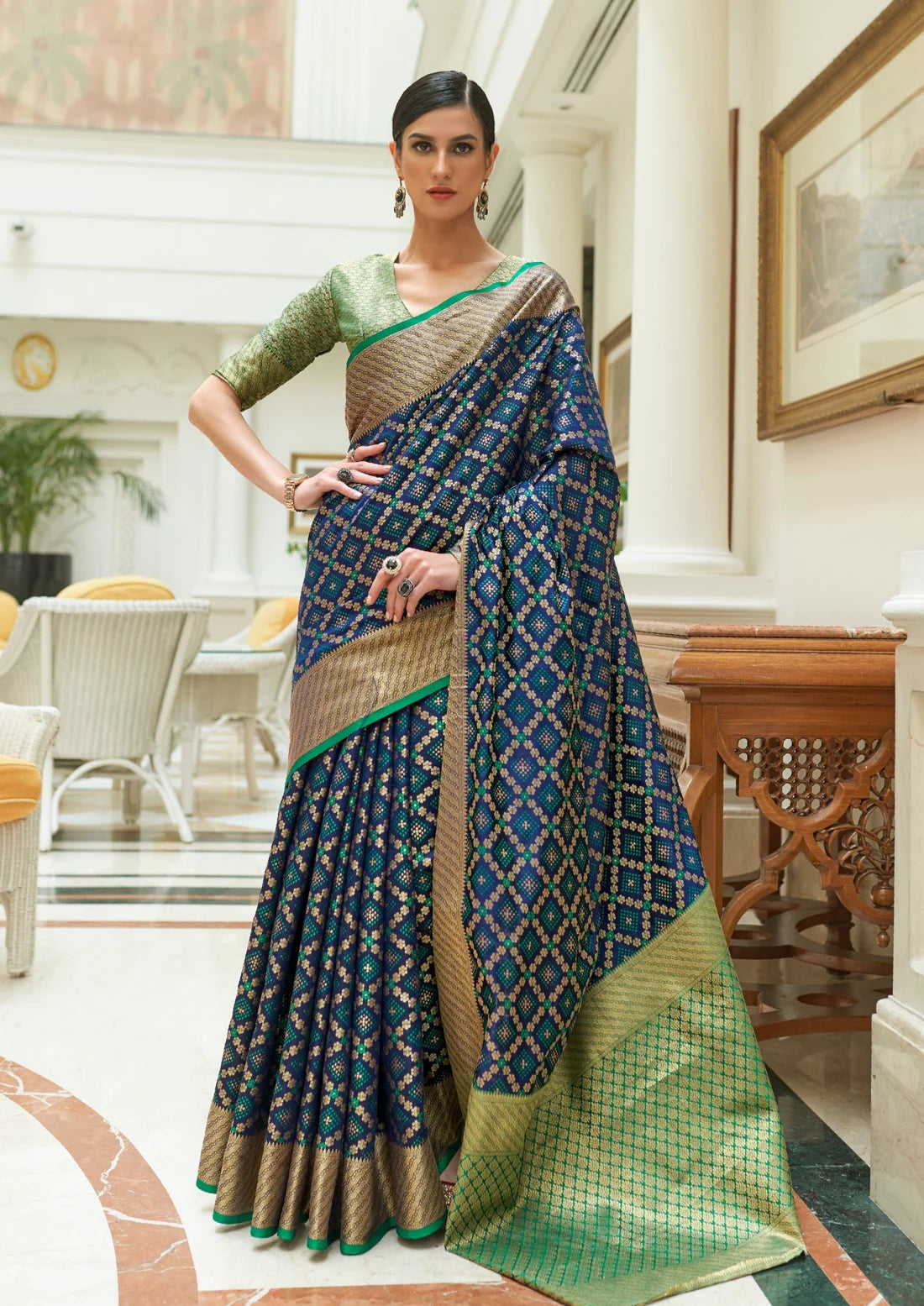 Banarasi silk ink blue bandhani saree with green blouse design.