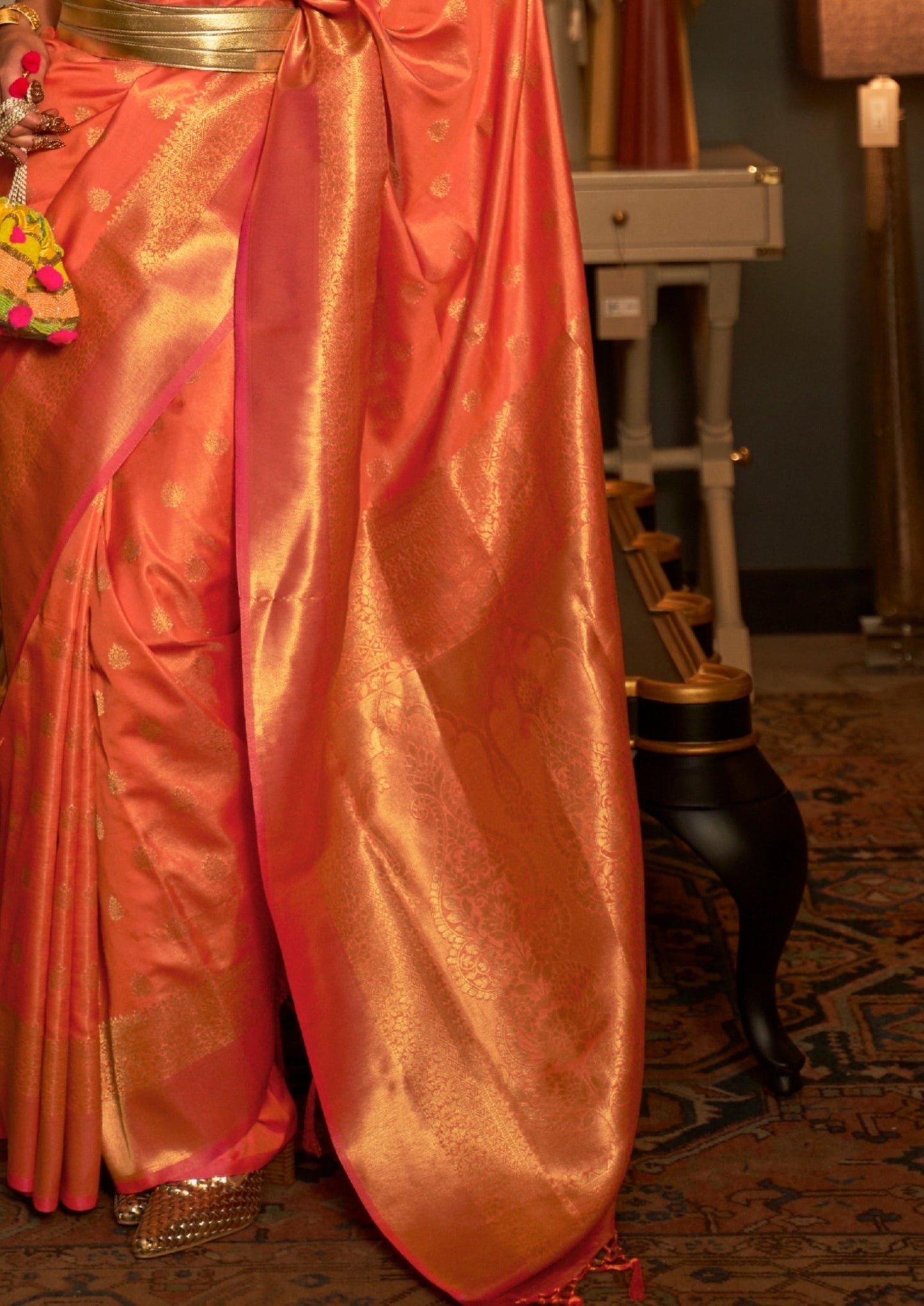 Banarasi silk orange handloom bridal saree with golden border online india.
