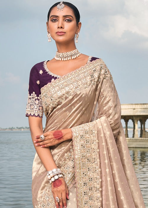 Designer banarasi silk premium saree in peach with mirror work and bead embellishments available for online shopping. 