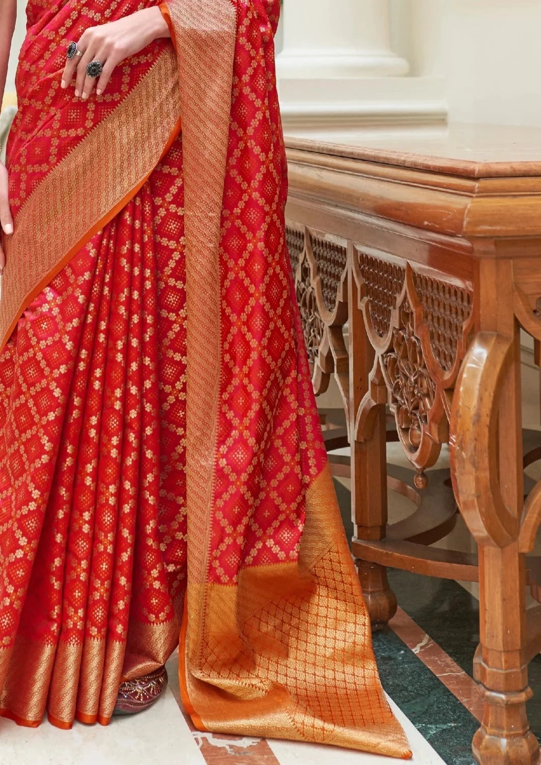 Red banarasi silk bandhani saree design.