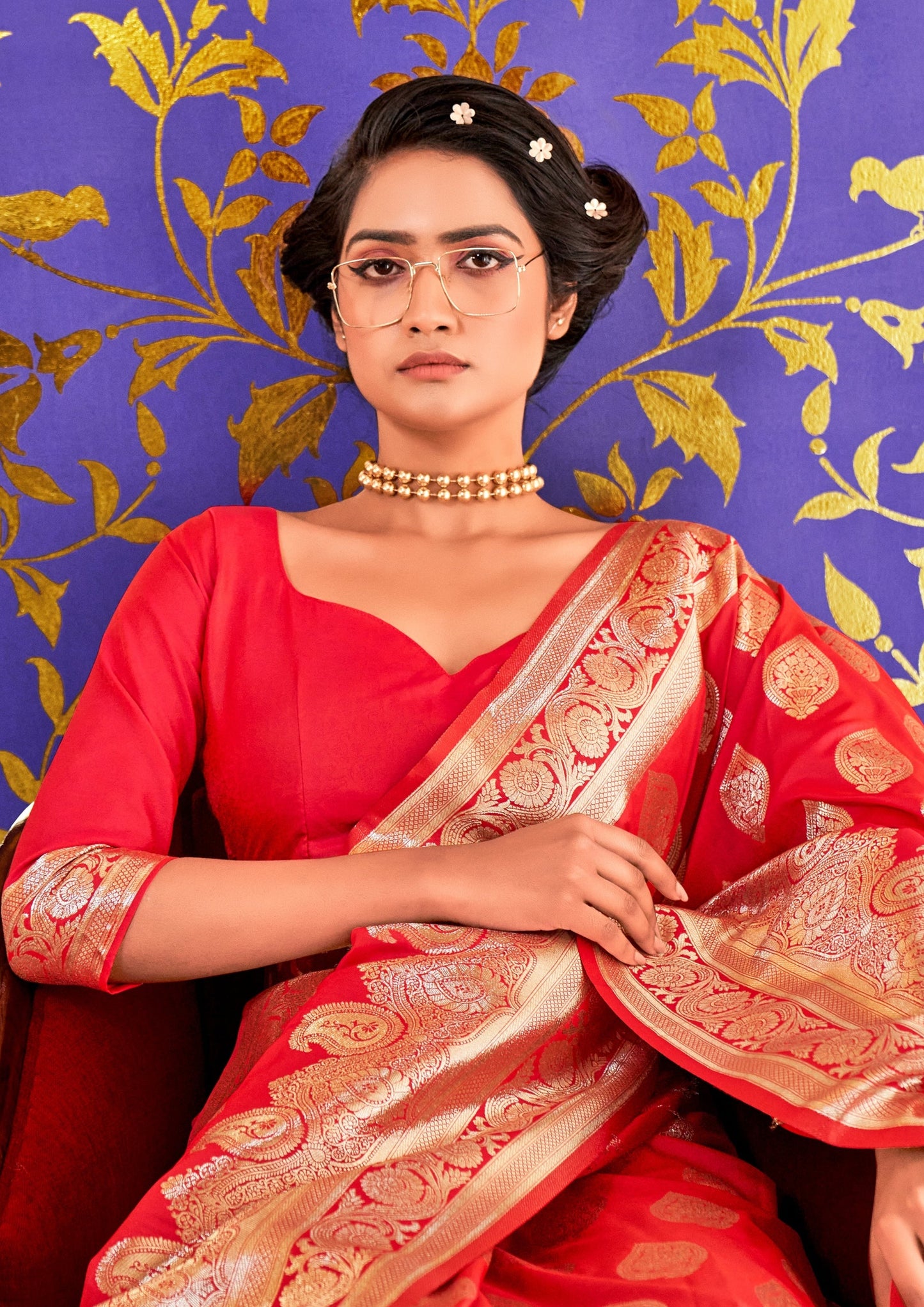Woman in red handloom banarasi saree