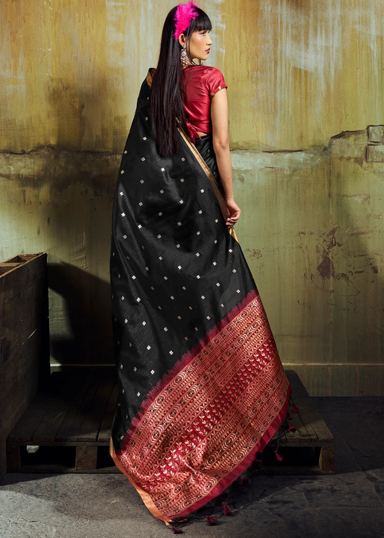 Black banarasi silk saree in norway featuring contrast red blouse and red pallu with intricate gold zari accents.