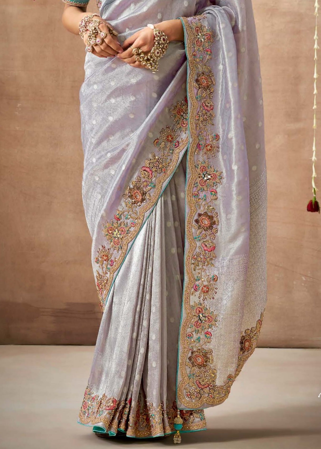 Banarasi tissue silk embroidery work silver saree online designs for indian wedding.