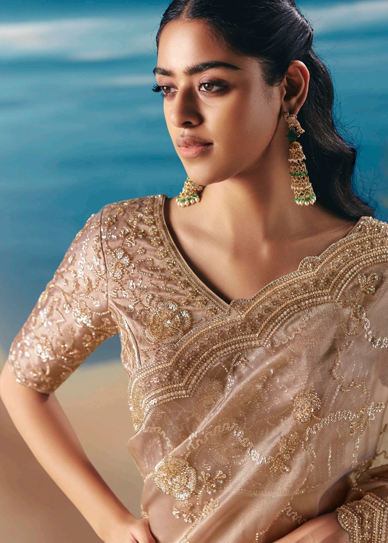 Soft beige tissue organza bridal saree & blouse design featuring intricate hand beadwork embroidery and sequin detailing for daytime wedding function or engagement ceremony.