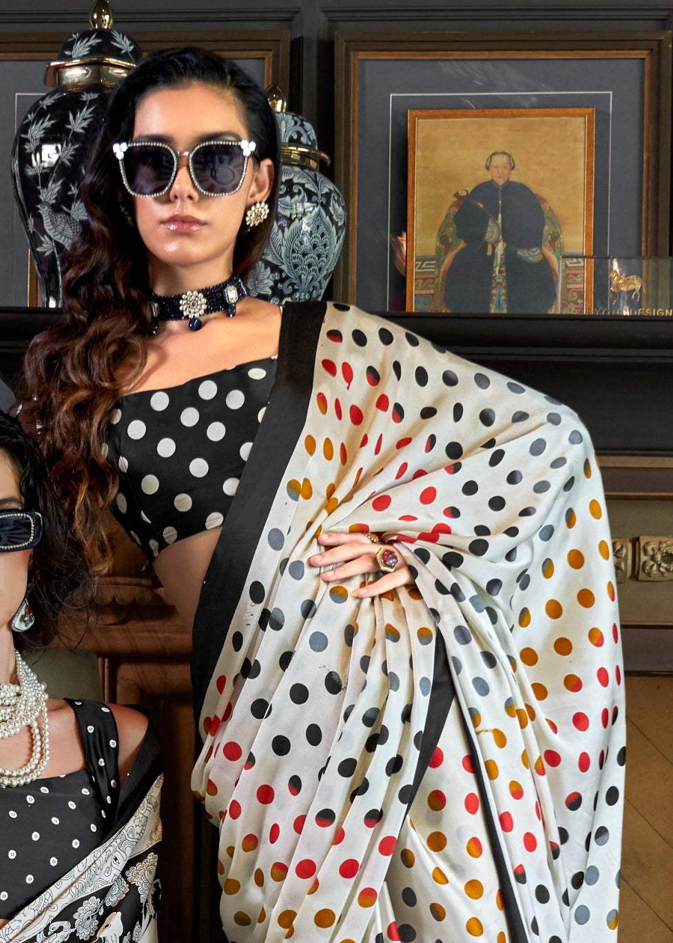 Digital print black and white polka dot saree in satin crepe, showcasing luxurious fabric and smooth drape for a sophisticated look.