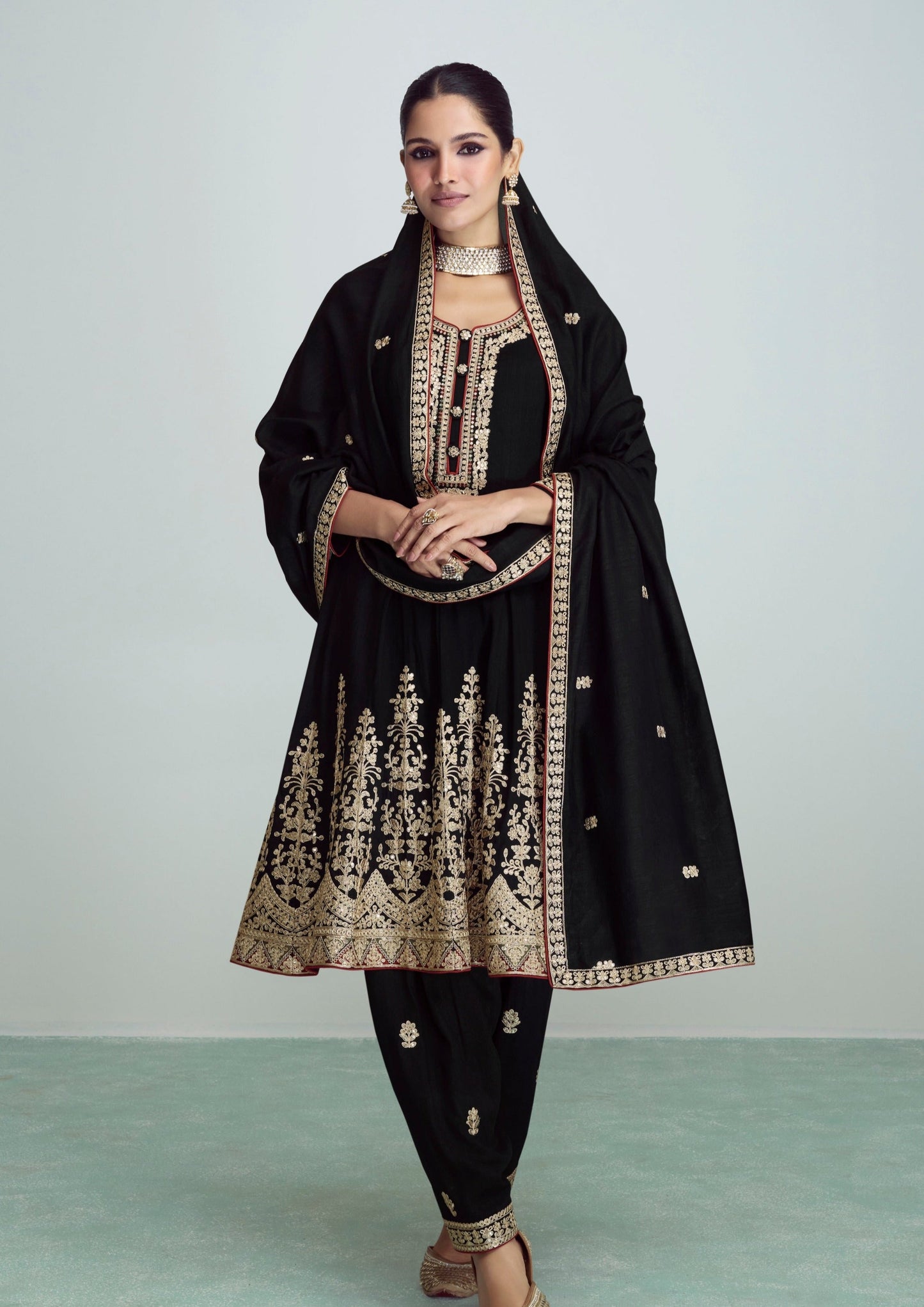woman in black luxury silk salwar kameez suit