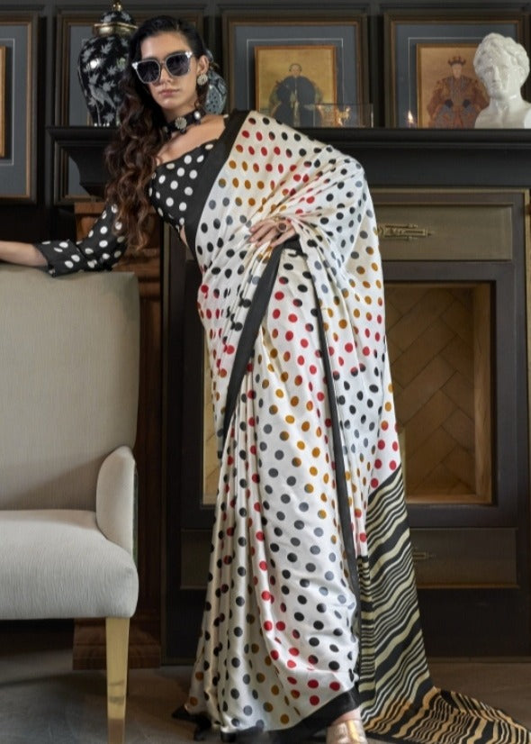 Stylish pure satin crepe white saree paired with black blouse with white polka dots  for a chic, modern look.