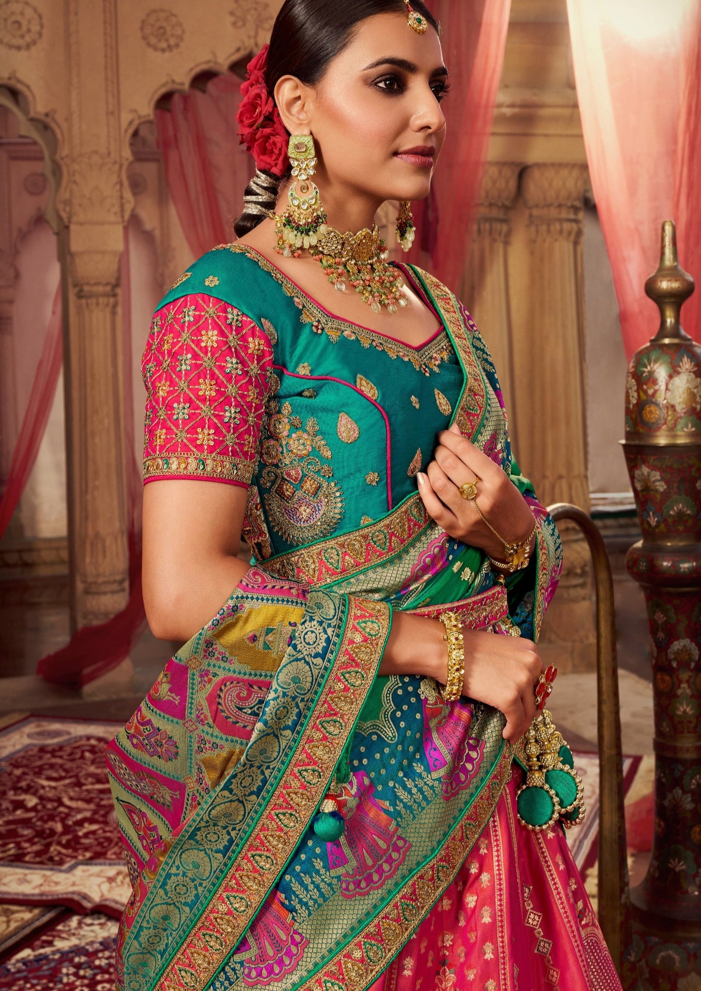 Woman in pink and blue combination banarasi silk lehenga choli.