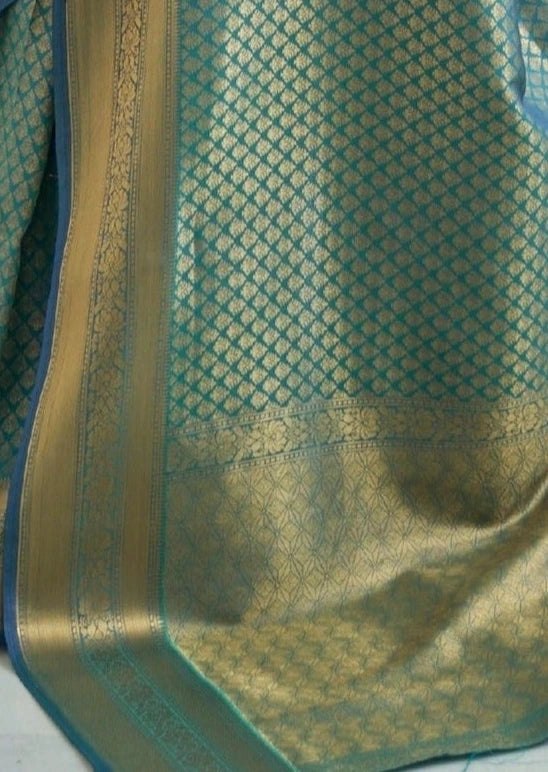 Blue kanjivaram silk saree pallu with intricate gold zari woven boota motifs and mughal designs.