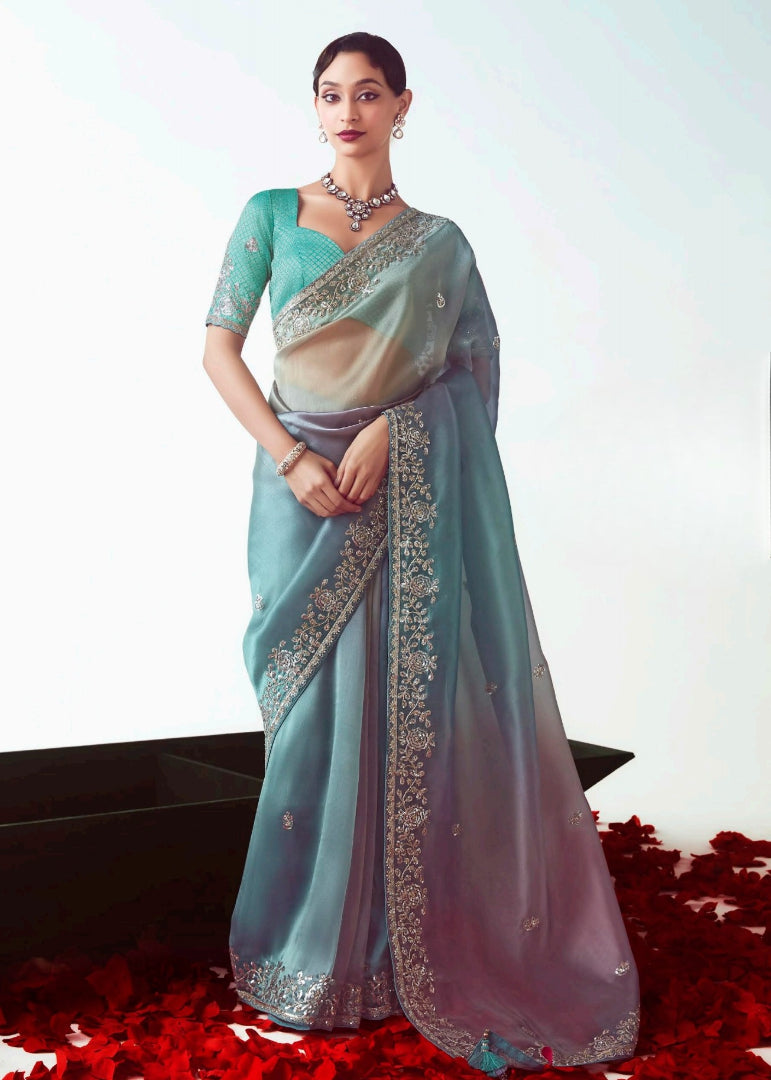 Designer organza tissue silk embroidered saree for wedding and reception in pastel and royal blue multicolor shades with contrast banarasi blouse.