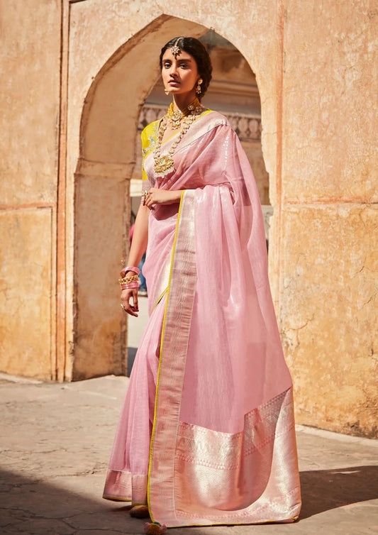 bride in pink organza saree and yellow silk blouse.