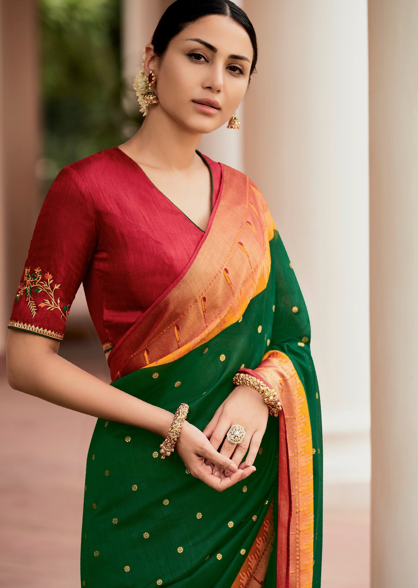 Brasso paithani saree online design for weddings in green color with contrast red blouse.