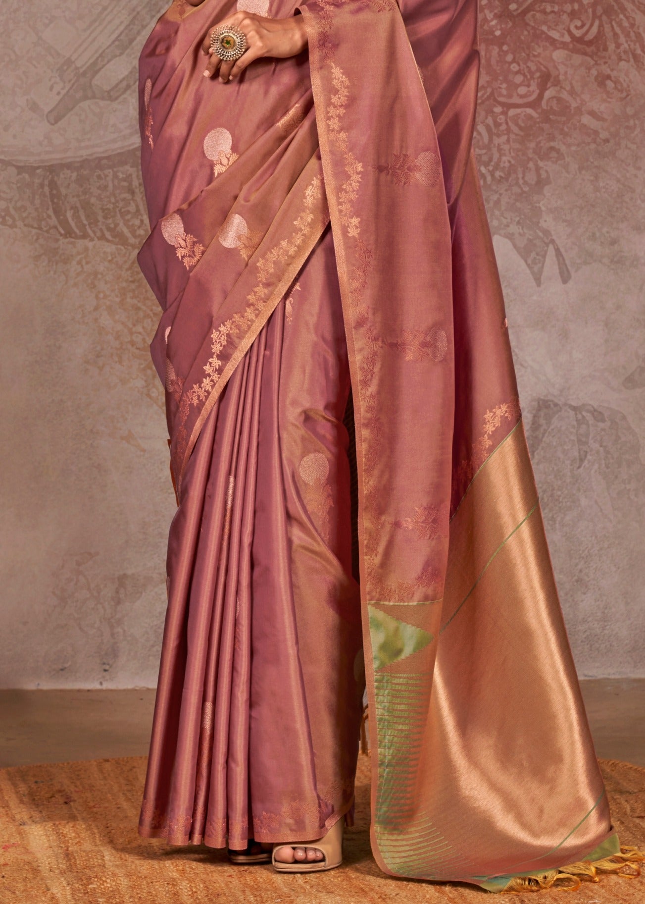 Luxurious brown handloom banarasi silk saree with intricate pattern work, complemented by a contrasting green blouse for a stunning ethnic saree look.