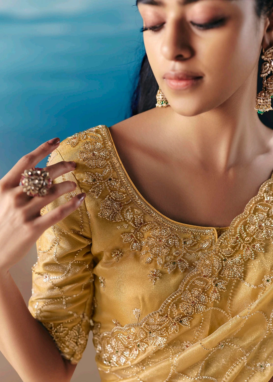 Elegant butter yellow tissue silk bridal saree with hand embroidery beadwork and sequins for engagement and wedding guest.