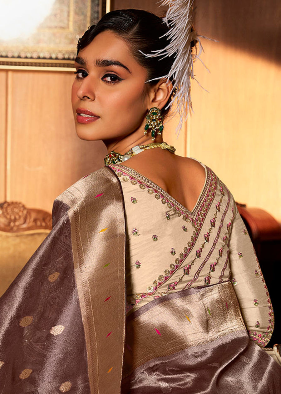 Close-up of gold-toned zari work on chocolate brown paithani saree available in usa online.
