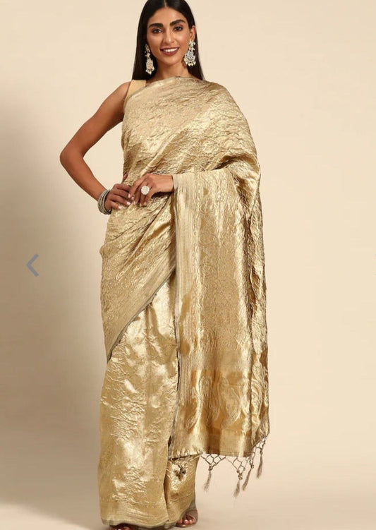 Womna in crinkled-silk-golden-saree