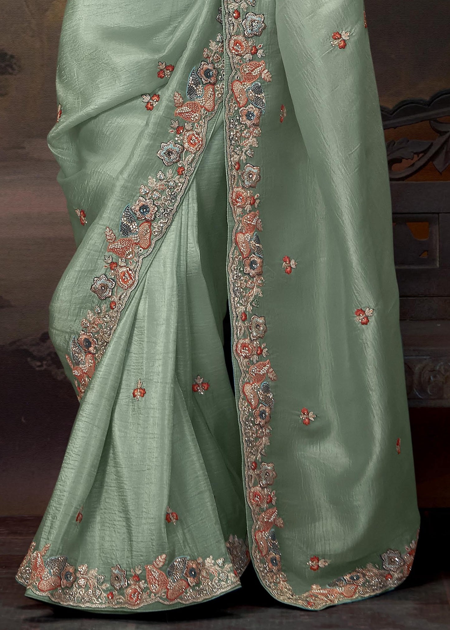 Sophisticated crushed tissue silk saree in pista green with handwork embroidery and dark green embroidered blouse piece for a stunning look.