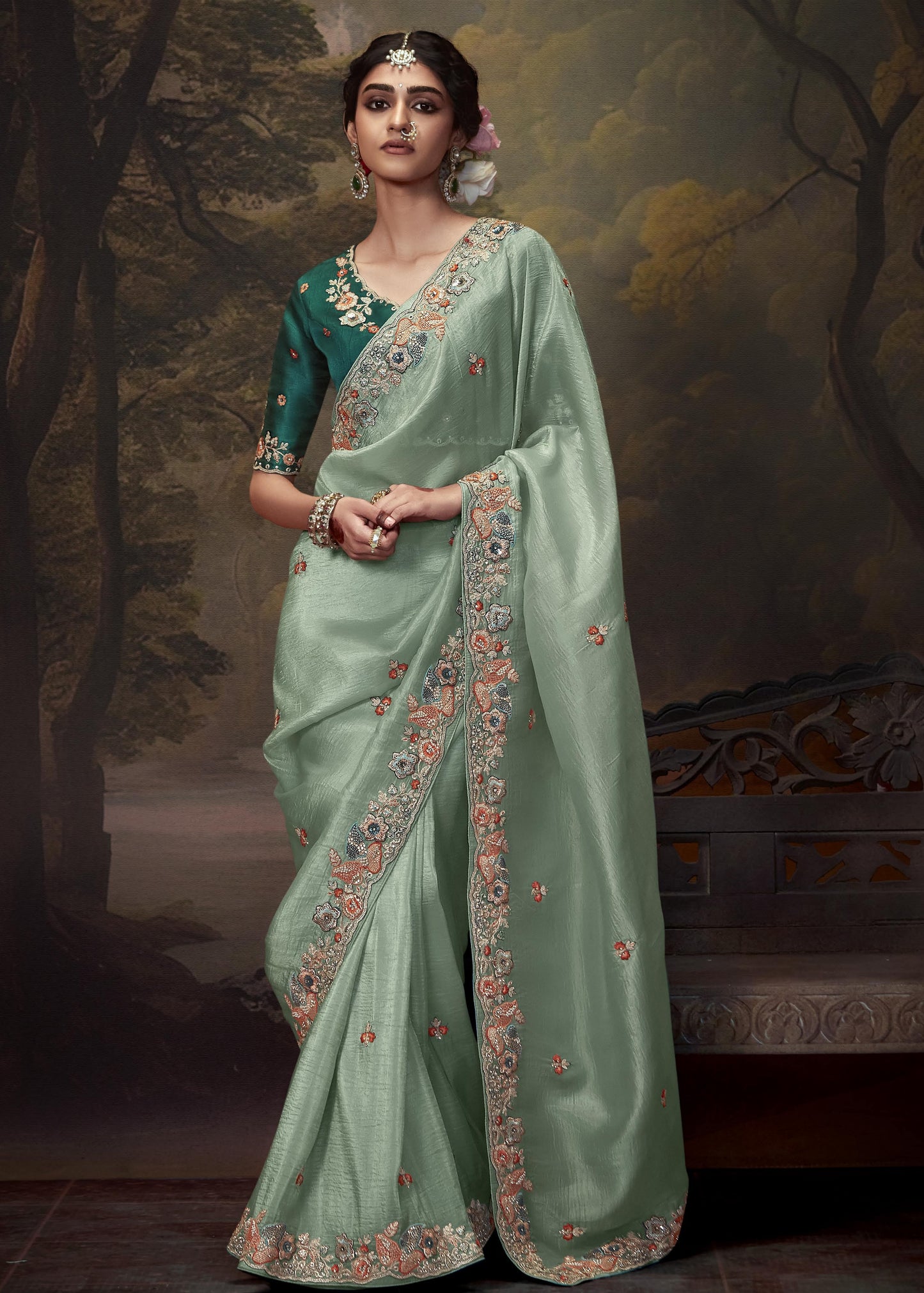 Crushed tissue silk pista green saree with intricate handwork embroidery and dark green blouse piece for elegant bridal or festive wear.