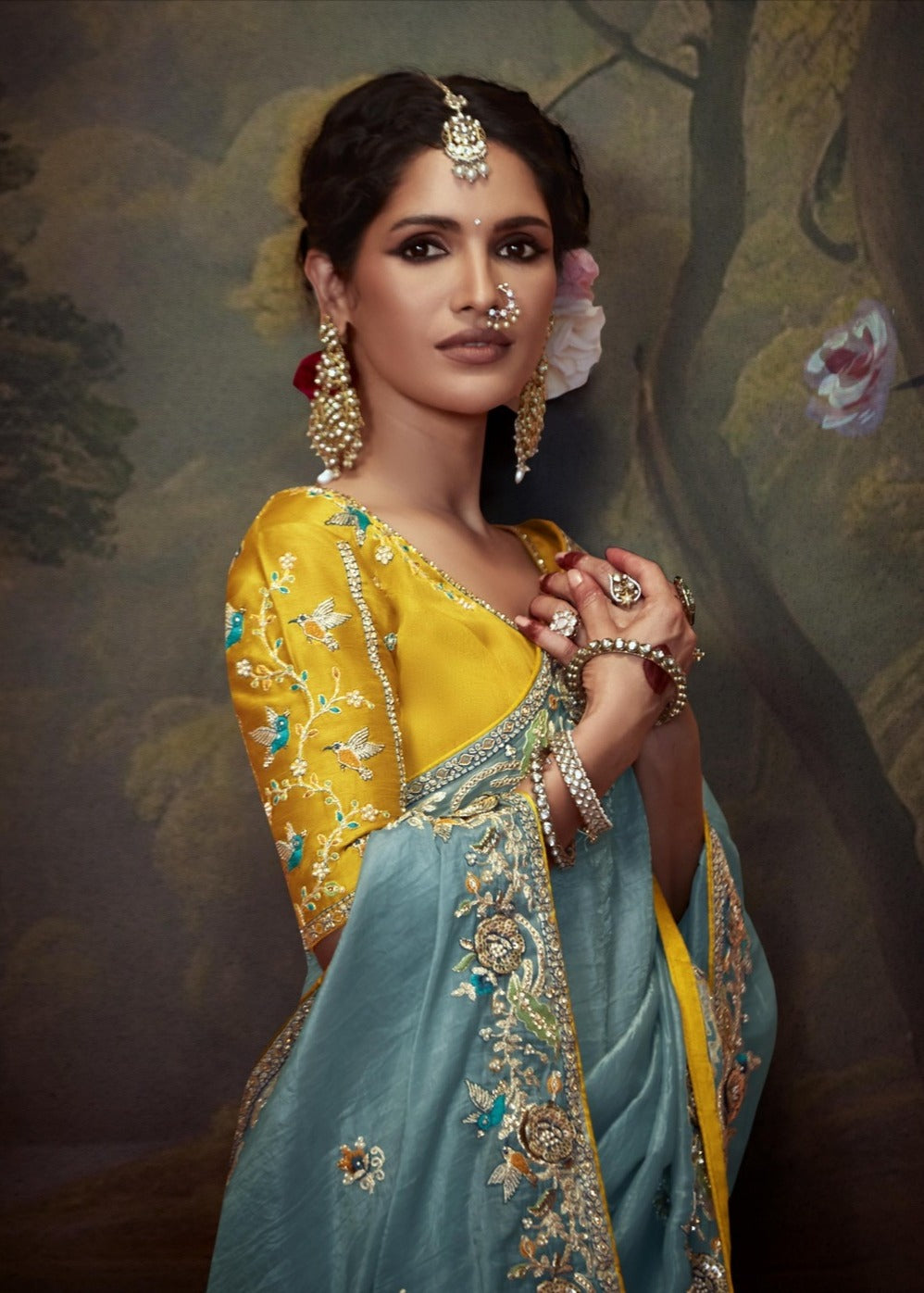 Crushed tissue silk saree online with handwork embroidery in sky blue colour with contrast yellow blouse.