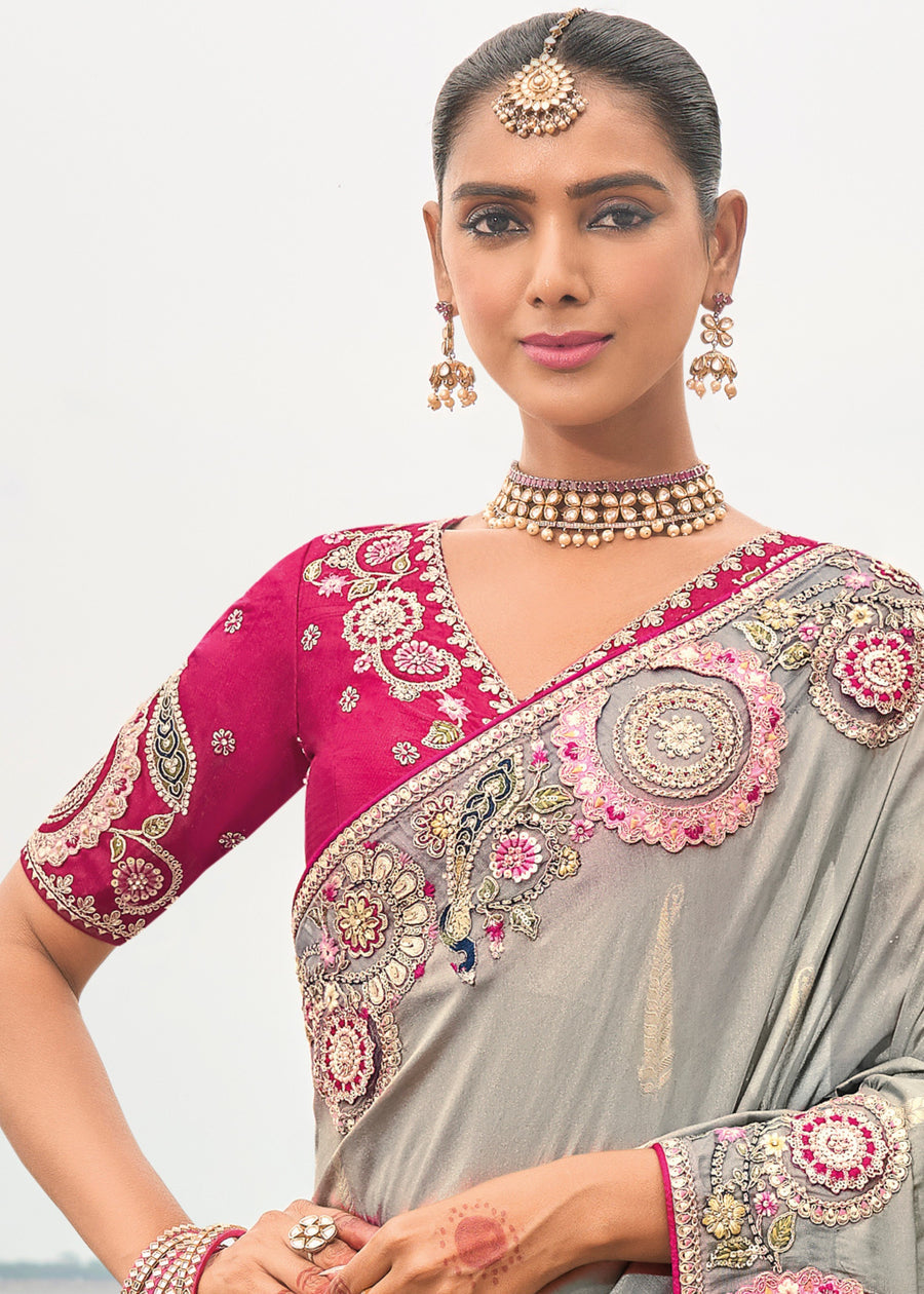 Grey tissue silk handloom banarasi saree with sequin embroidery and rani pink embroidered blouse for festive occasions.
